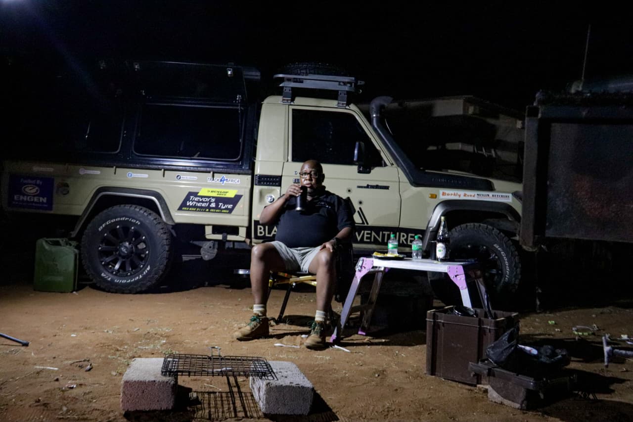 Aslam recording podcast with overlanding guest