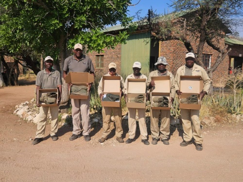 Paul Stones Safari Africa team receiving Jim Green boots