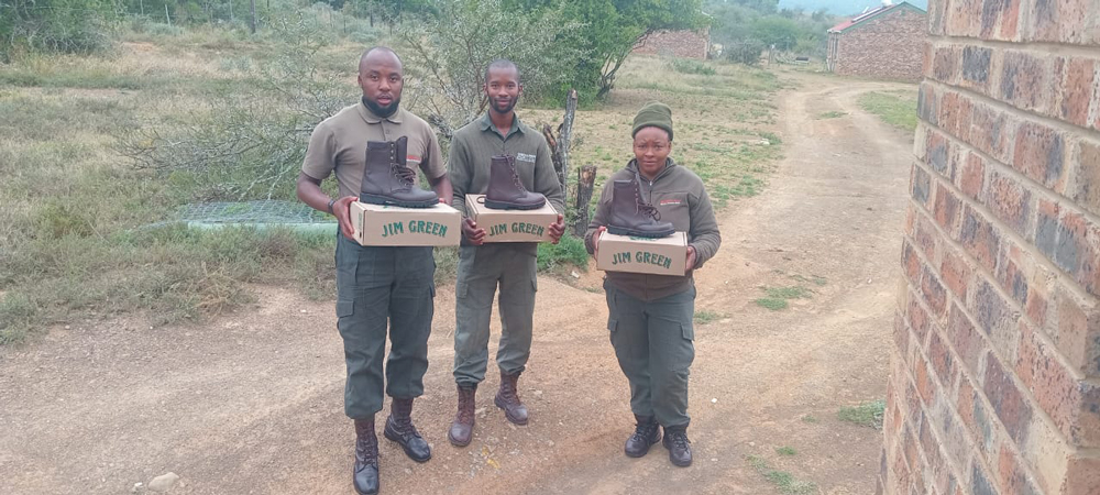 Great Fish River Nature Reserve rangers holding their Jim Green boots outside